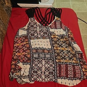 By by open back shoulderless tee.